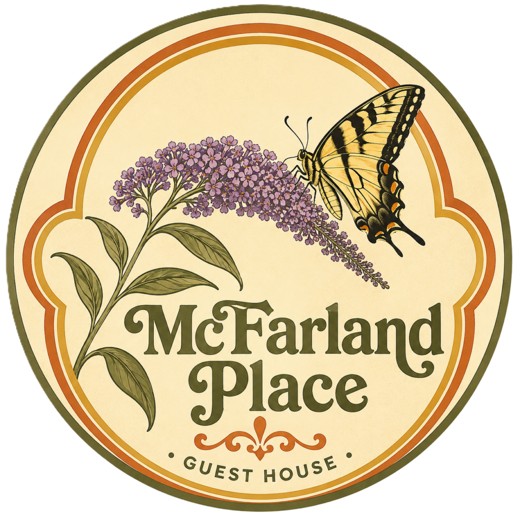 Butterfly Landing on a purple flower withthe text McFarland Place