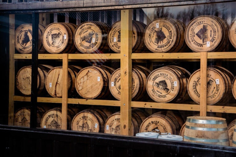 A wall of bourbon barrels
